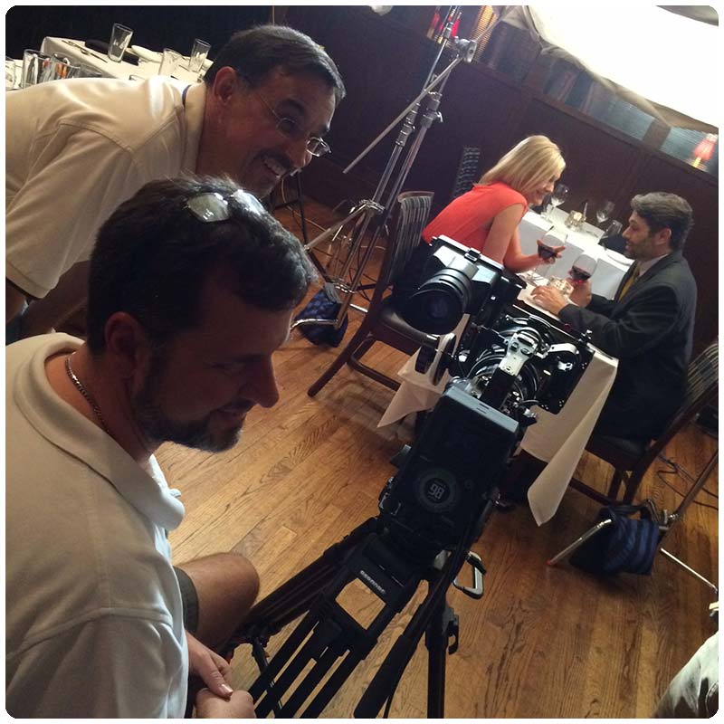 Chris Allain and Scott Rachal filming on a set.