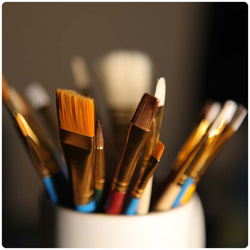 Paint brushes in a jar.